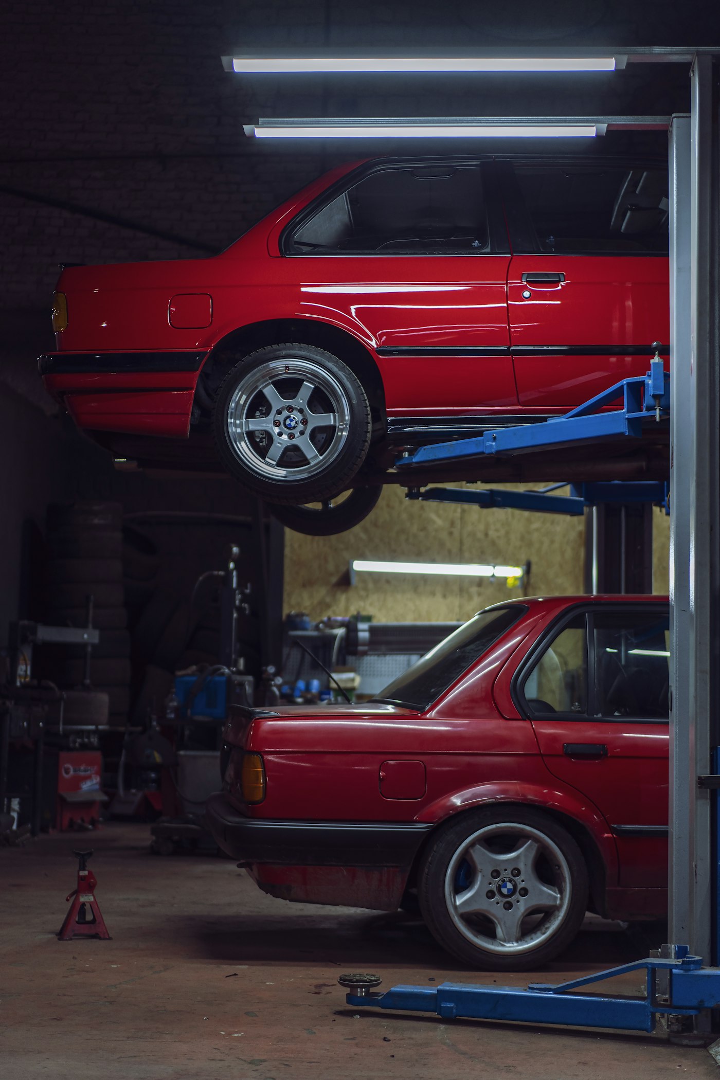 A vehicle raised on a lift inside the Imperial Auto Service workshop